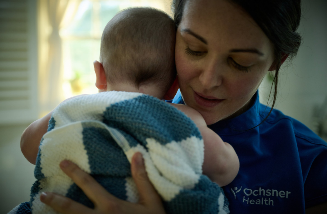 Ochsner nurse with baby.png (sponsored)